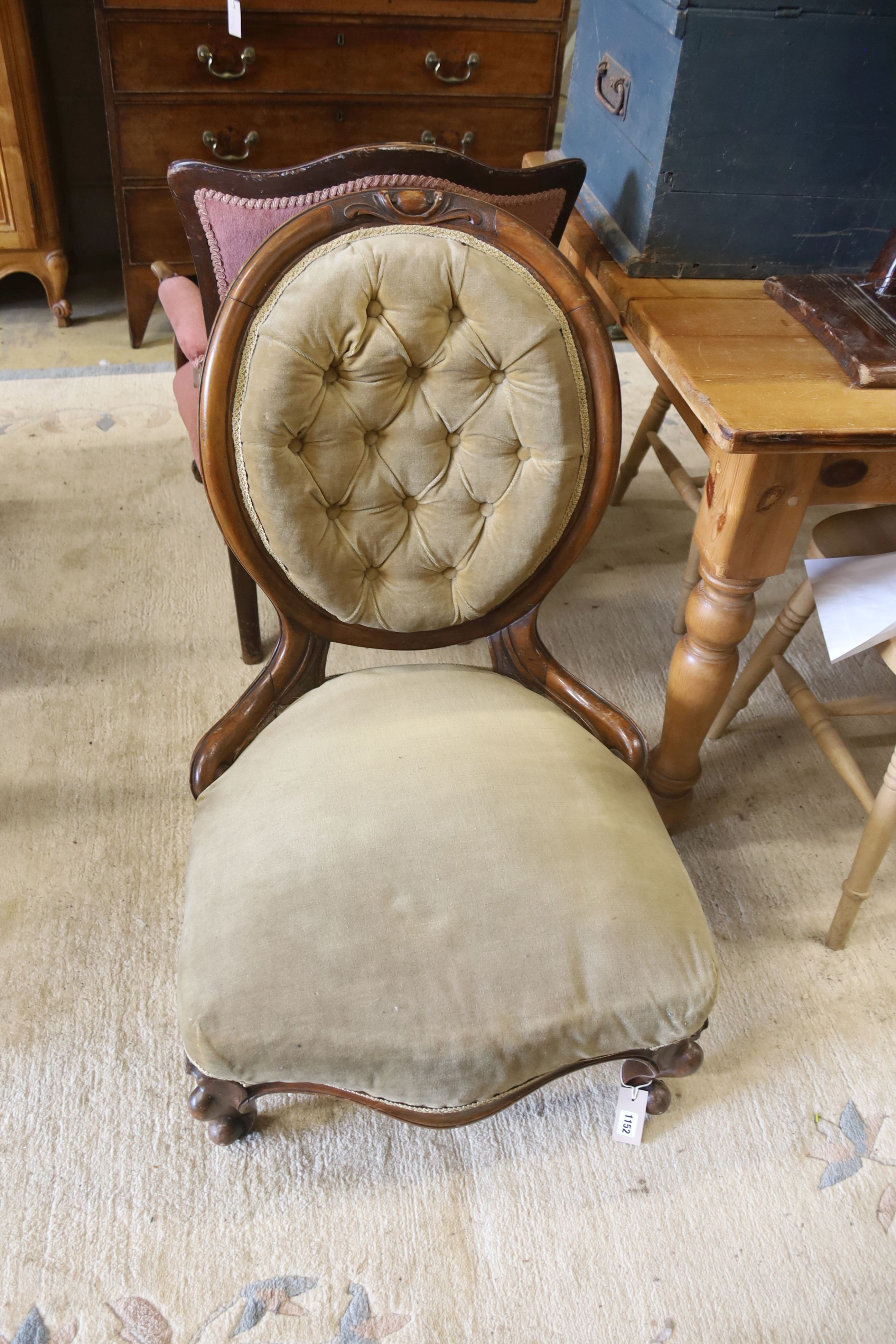A Victorian walnut spoonback nursing chair